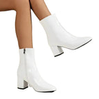 Close angled view of black ankle boot on white background showing sheen of the upper