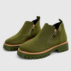 Olive green suede ankle boots with tonal lugged sole and gold-tone zipper pull
