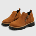Tan brown suede ankle boots with contrast stitching and chunky black sole, side view
