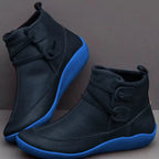 Navy ankle boots with bright blue contrast sole and decorative front lacing detail