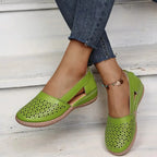 Light green cut-out leather flat with elasticated side strap, worn with cropped denim