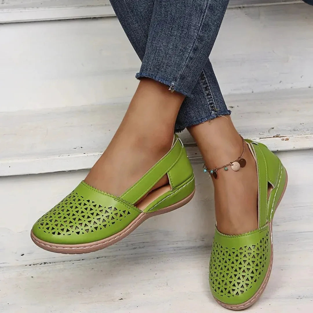 Light green cut-out leather flat with elasticated side strap, worn with cropped denim