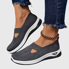 Side view of green knitted trainer highlighting diamond-stitch texture and cut-out panel