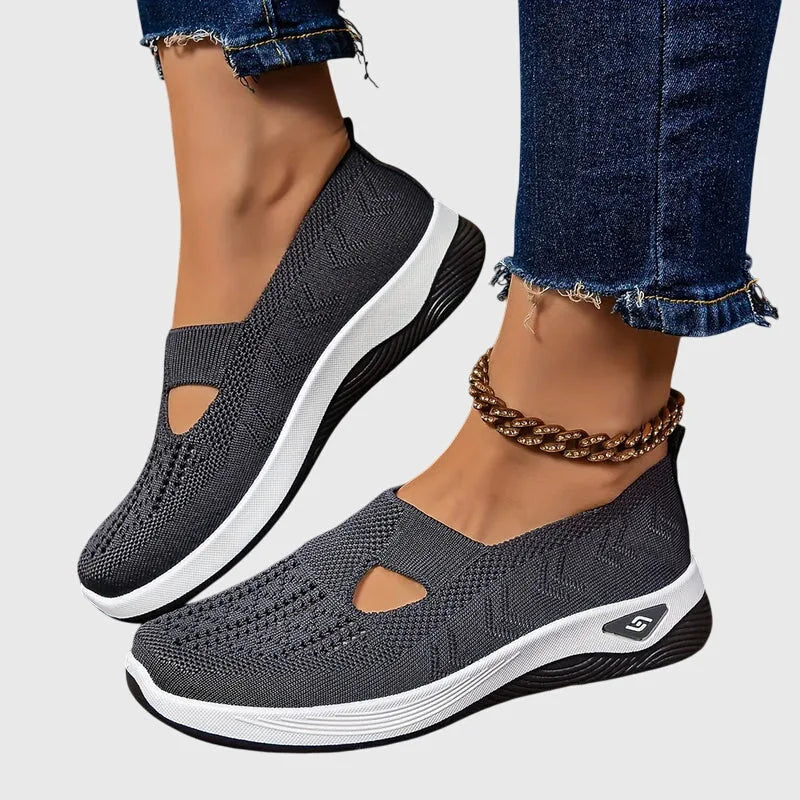 Side view of green knitted trainer highlighting diamond-stitch texture and cut-out panel