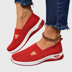 Top-down view of blue knitted slip-on trainers with beaded anklet and white contrast sole