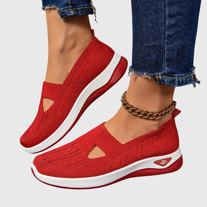 Top-down view of blue knitted slip-on trainers with beaded anklet and white contrast sole
