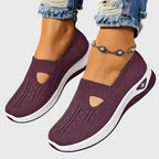 Purple knitted trainer sole detail with white ridged outsole and side logo emblem
