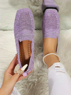 Purple speckled knit flats worn on foot, top view showing perforated toe and ribbed collar