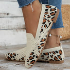 Leopard print knitted flats worn on foot, rear and side view showing heel and print detail