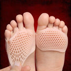 Close-up of feet on honeycomb-textured silicone forefoot cushioning pads for added comfort and arch support