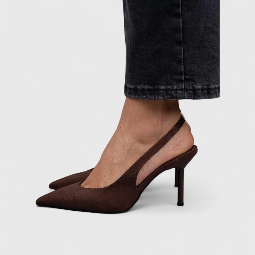 Close-up of dark brown suede slingback heel showing slim stiletto and pointed toe