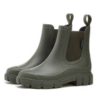 Olive green waterproof Chelsea boots with matte finish, lug sole and fabric side panel detail.