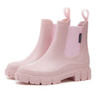 Pink Chelsea rain boots side view, showing the elastic panel, pull tab and durable ridged outsole.