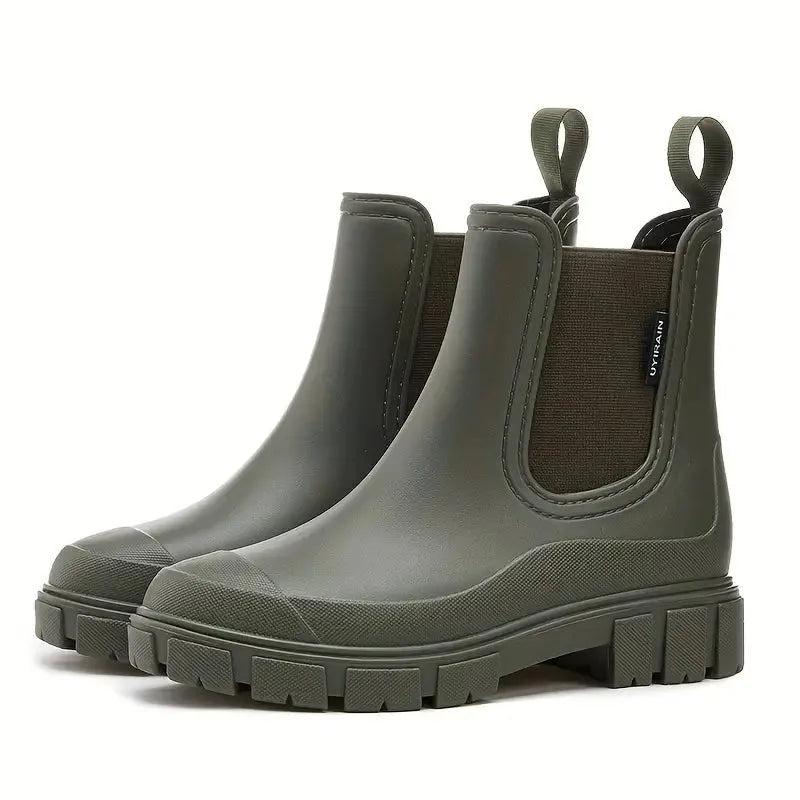 Olive green Chelsea boots with contrasting dark elastic gusset and deep-tread platform sole