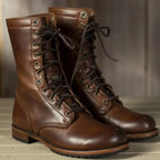Side view of dark brown leather lace-up combat boots with round toe and stacked heel