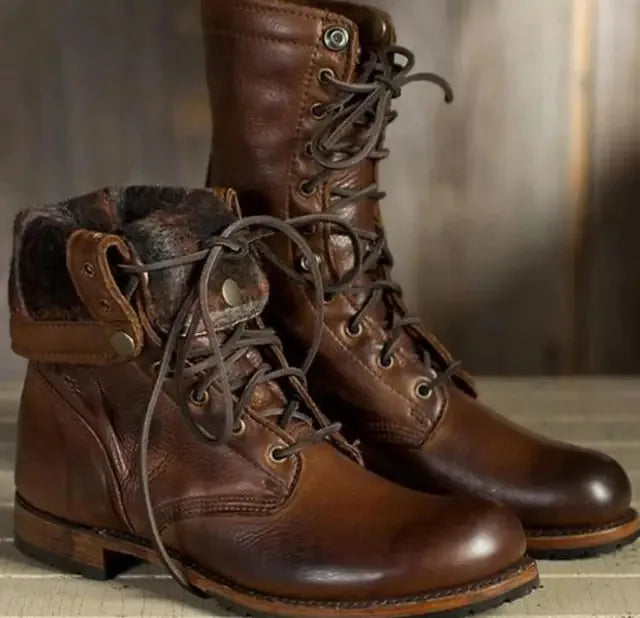 Dark brown leather combat boots with fold-over cuff and tan leather trim detail