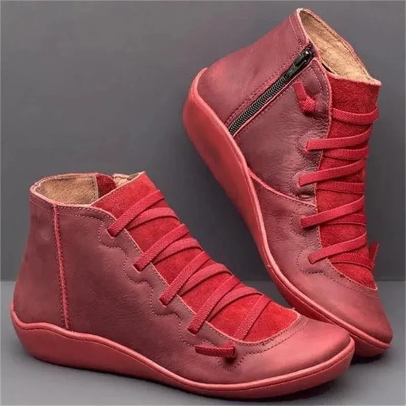 Deep red leather ankle boots with stretch lacing detail and tonal zip pull, side and back view