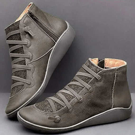 Grey leather ankle boots with contrast suede panels and cross lacing, side by side view