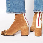 Tan suede ankle boots with leopard-print toe cap and ruched shaft, worn with cropped denim